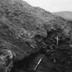 Excavation photograph : midden (9) on north side of wall (8).