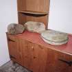 Muck, Port Mor. Rotary quern and fragments of two saddle querns (including that from NM48SW 12).