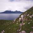 Eigg, Poll Duchaill, Fort. View from S of fragment of W wall.