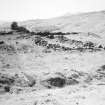 Excavation photograph : deserted cluster east Lix (EL/I) with byre dwelling D in centre.