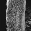 General view of Pictish stone bearing three symbols: part of what may be a 'flower' or possibly a notched rectangle, a crescent and V-rod, and a mirror-and-comb.