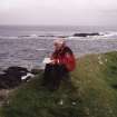 Muck, Caisteal an Duin Bhain. Fort. Site survey in progess. Ian Parker with the drawing board.