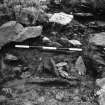 Photograph of cist, partially excavated.