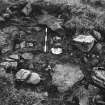 Photograph of excavated area of cairn and cist.