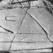 Rock carvings - N. footprint and ogam inscription.