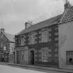 General view of 51 Main Street and Parish Church, Colinsburgh, from north west.