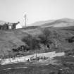 General view of caves, looking across sheep-pens from S.