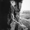 View from inside of entrance to E cave, showing inscribed markings.