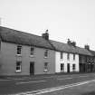 View of row of dwellings opposite the Red Lion Hotel, High Street, Ayton (Numbers 41-37 from the left).