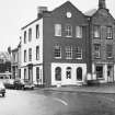 View of  'Gents Hair Stylist' and 'John Hosgrove Ltd'.