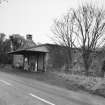 General view from SW of mill at road level, with kiln in background