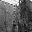 View from E of NE side of mill, with two arches of the tailrace visible (bottom foreground)