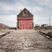 View from WSW looking up slipway towards W gable of boat house