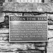 View of plaque.
Insc: 'Foulden Tithe Barn', 'This building appears to have been used as a barn for the tithes of produce from the parish. The original date of construction is unknown and the building has been considerably altered in the 18th and 19th centuries'.