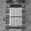 Detail of third floor W facade pedimented window inscribed "A L 1774".