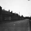 View down road on unidentified street.