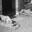 Detail of carved stone dogs flanking entrance to South West block.