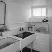 Interior. Basement utility room with belfast sinks