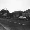 View of Main Street showing phone box and Esso garage.