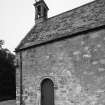 Detail of SW corner showing door, sundial and pulpit