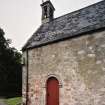 Detail of SW corner showing door, sundial and pulpit