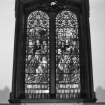 Interior. Detail of stained glass window in N aisle dated 1914