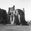 View from NE of N transept, E windows, night stair doorway, site of Chapter House