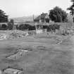 General view from SE of remnants of chapter house and novices' day room
original tiles