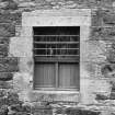 Detail of ground-floor window in two-storeyed building in NW range