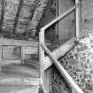 Interior: N-W range, detail of wooden staircase