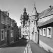 Oblique view from SE of SW elevation looking down Cross Wynd.