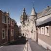 Oblique view from SE of SW elevation looking down Cross Wynd.