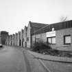 Oblique view from NE along Mansfield Crescent, showing northern part of works (still in use), with four-storeyed block in background (recently converted into flatted dwellings)