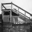 General view of predominantly wooden construction of footbridge.