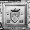 Detail of heraldic panel dated 1859 above W entrance.
