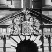 Detail of burgh arms over main doorway of SW front.