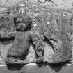 Detail of carved panel representing cherub above S door.