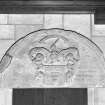 Interior. Chancel. Detail of 17th century carved tympanum above door at N