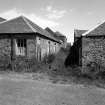 View from W along passage between cattle shed and threshing barn.