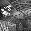 Interior.
View of conveyor in straw barn.