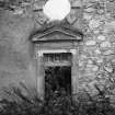 Detail of pedimented doorway with oculus in NW elevation.