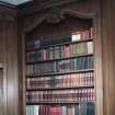 Interior. Octagonal library detail of panelling and bookcase