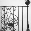 Interior. Spiral stair detail of Thomas Hadden wrought iron balustrade with curling equpment