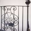 Interior. Spiral stair detail of Thomas Hadden wrought iron balustrade with curling equpment