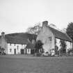 View of  garage and cottage block from SW