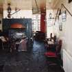 Interior.
Willie Wastle's bar, view from S showing circular fireplace and original 1930's 'Swiss' furniture.