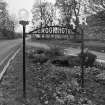 Detail of roadside 1930's 'Crook Hotel' sign to S attributed to Thomas Haddon and Company.