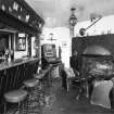 Interior.
Willie Wastle's bar, view from ESE showing fireplace and bar with original 1930's 'Swiss' furniture.