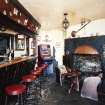 Interior.
Willie Wastle's bar, view from ESE showing fireplace and bar with original 1930's 'Swiss' furniture.