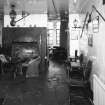 Interior.
Willie Wastle's bar, view from S showing circular fireplace and original 1930's 'Swiss' furniture.